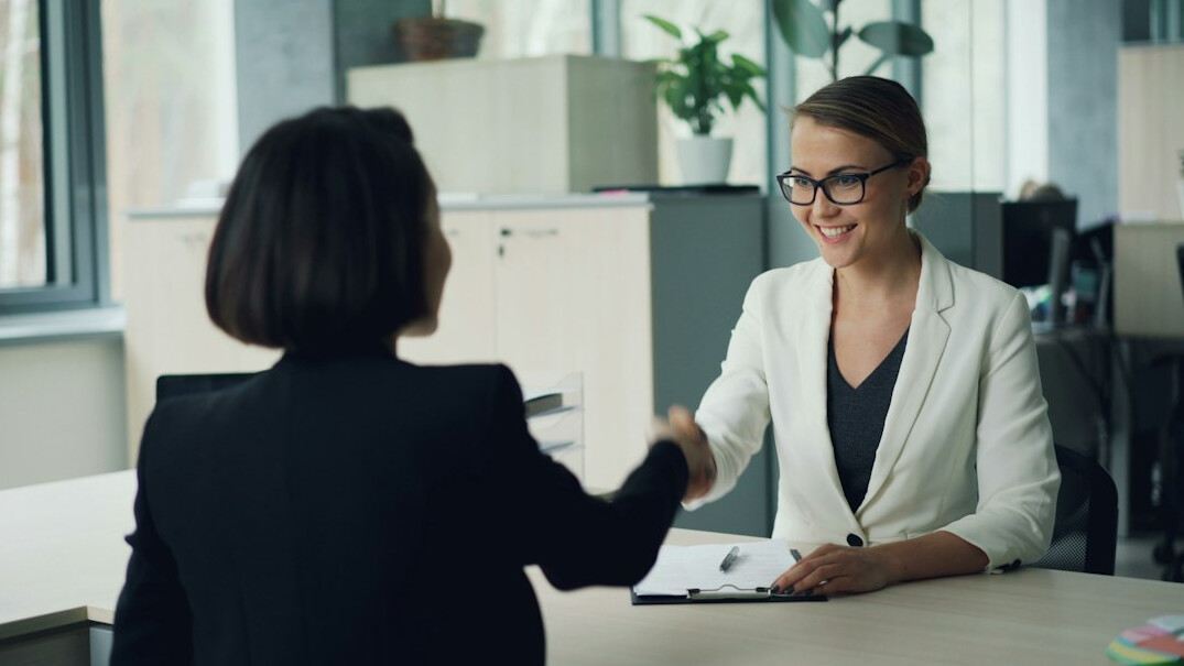 woman interviewing guest