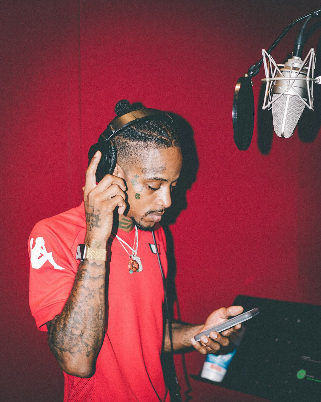 Man recording a podcast episode with headphones and microphone