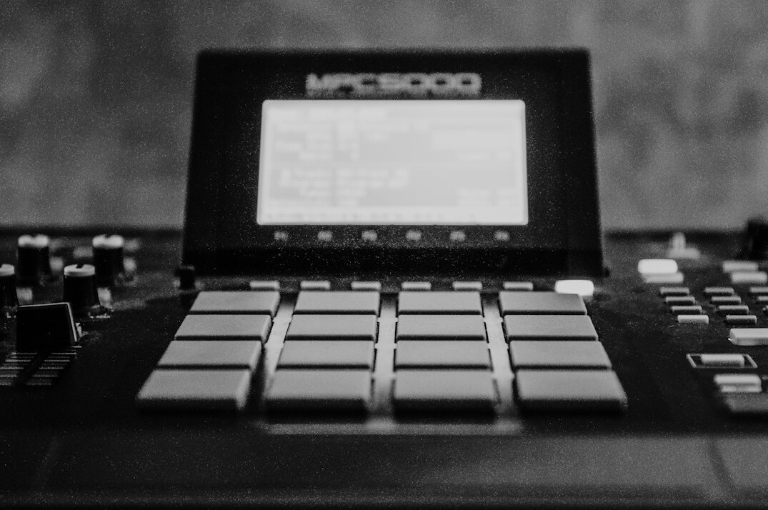 Audio waveform editing on a laptop screen in a studio